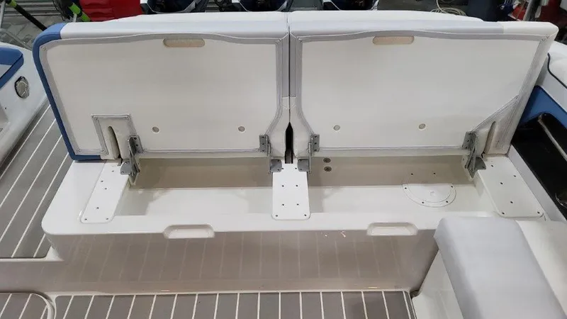 Slide: The Image of 2025 Formula 330 Crossover Bowrider OB seating storage compartment, open view. - 16