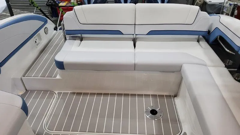 Slide: The Image of 2025 Formula 330 Crossover Bowrider OB interior seating with white and blue upholstery. - 18
