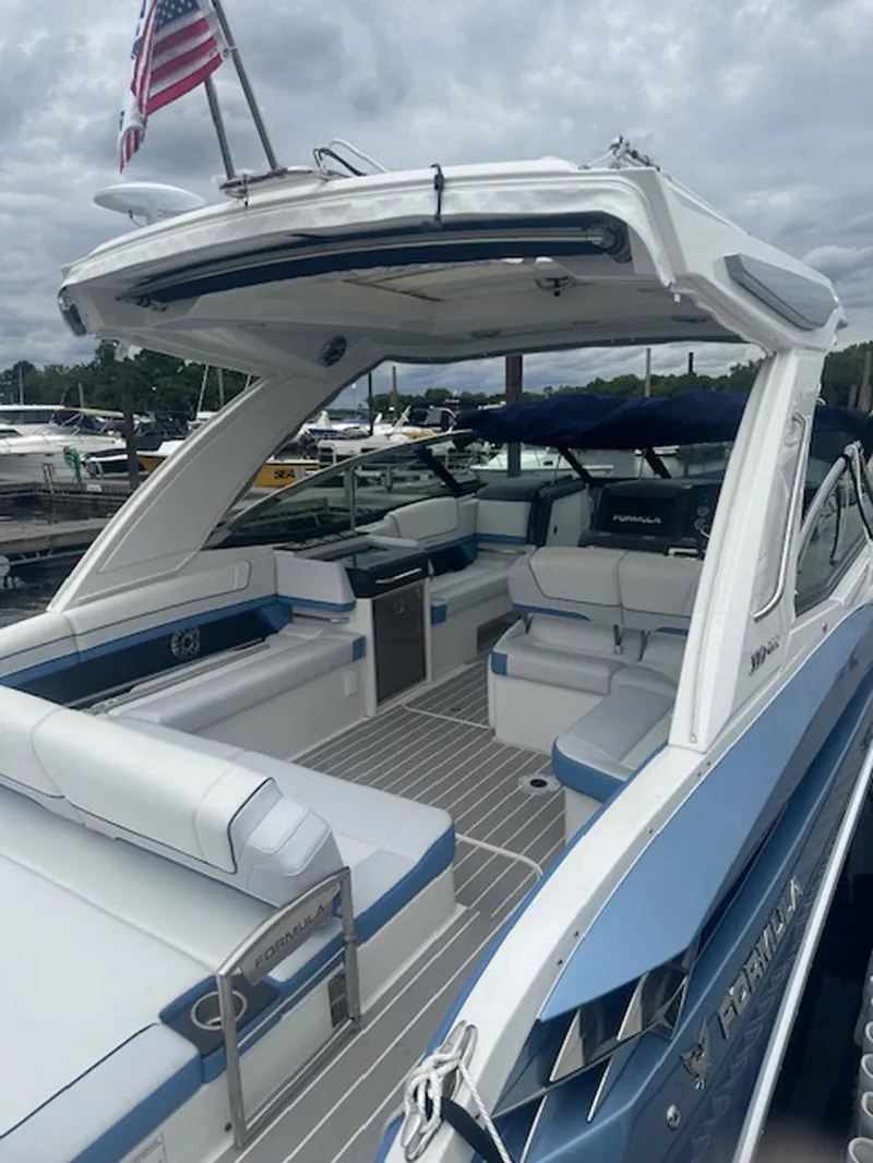 Slide: The Image of 2025 Formula 330 Crossover Bowrider OB, luxury boat with spacious seating and sleek design. - 25