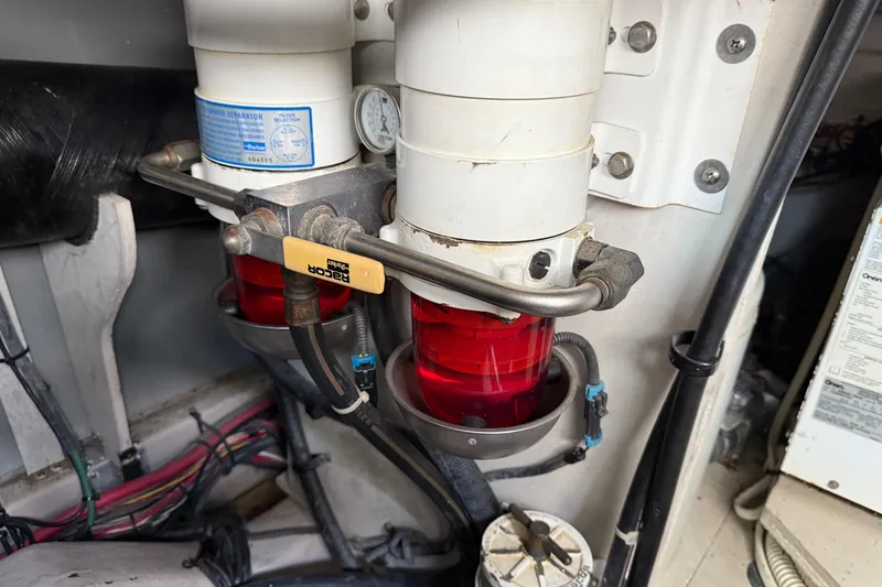 Slide: The Image of Engine room of 2006 Sea Ray 48 Sundancer showing fuel filters and wiring. - 100