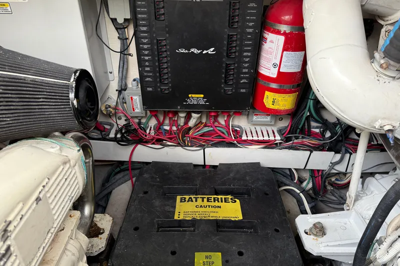 Slide: The Image of Engine room of 2006 Sea Ray 48 Sundancer with electrical panel and fire extinguisher. - 102