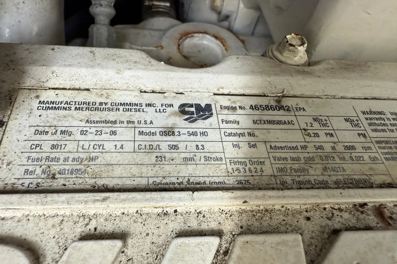 Slide: The Image of Cummins engine label on 2006 Sea Ray 48 Sundancer, detailing specifications and manufacturing information. - 105