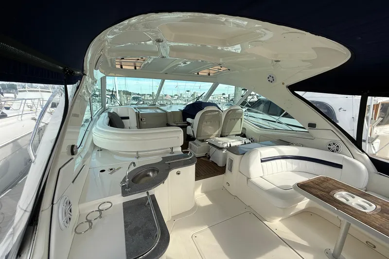 Slide: The Image of Luxurious 2006 Sea Ray 48 Sundancer yacht interior with elegant seating and modern amenities. - 12