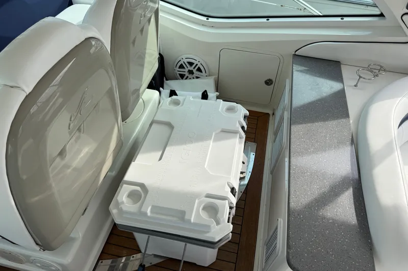 Slide: The Image of Interior of 2006 Sea Ray 48 Sundancer with seating and cooler on deck. - 18
