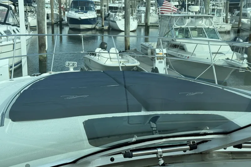 Slide: The Image of 2006 Sea Ray 48 Sundancer yacht docked at marina with other boats. - 22