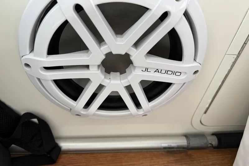 Slide: The Image of White JL Audio speaker on 2006 Sea Ray 48 Sundancer boat interior. - 26