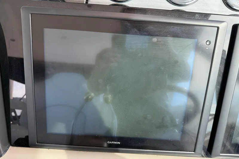 Slide: The Image of Garmin display on 2006 Sea Ray 48 Sundancer yacht dashboard. - 31