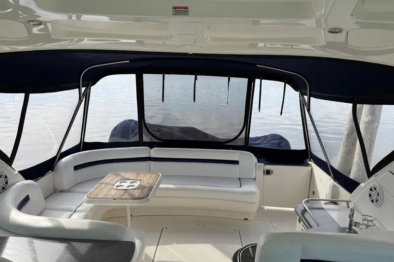 Slide: The Image of Interior view of 2006 Sea Ray 48 Sundancer yacht with seating and table. - 47