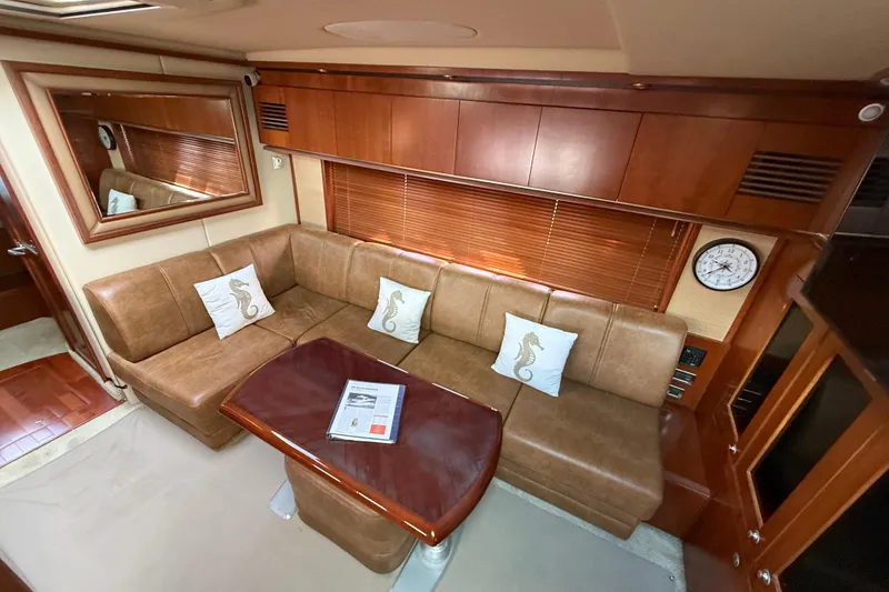 Slide: The Image of Luxurious interior of 2006 Sea Ray 48 Sundancer yacht with leather seating and elegant decor. - 49