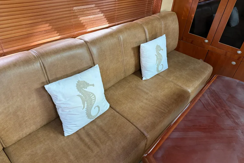 Slide: The Image of Luxurious interior of 2006 Sea Ray 48 Sundancer with seahorse-themed cushions. - 54
