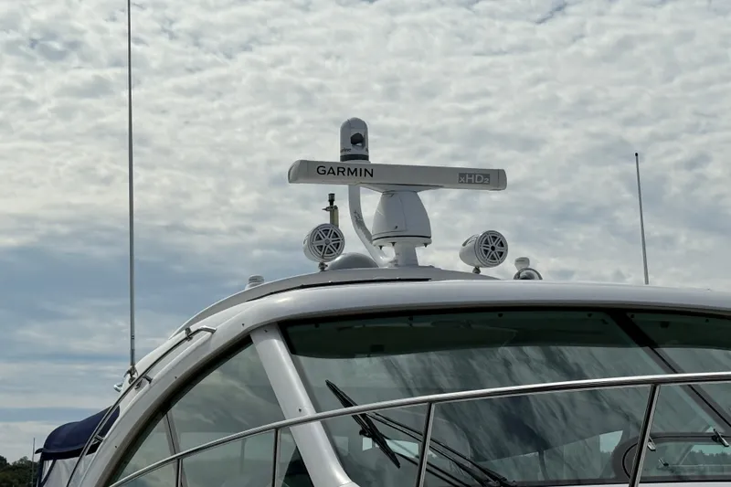 Slide: The Image of 2006 Sea Ray 48 Sundancer yacht with Garmin radar system under cloudy sky. - 6