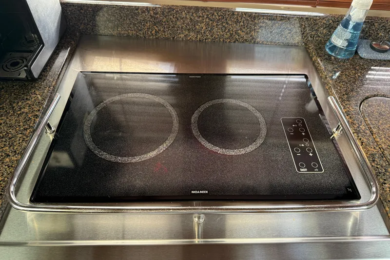 Slide: The Image of Built-in stovetop on 2006 Sea Ray 48 Sundancer yacht kitchen counter. - 62
