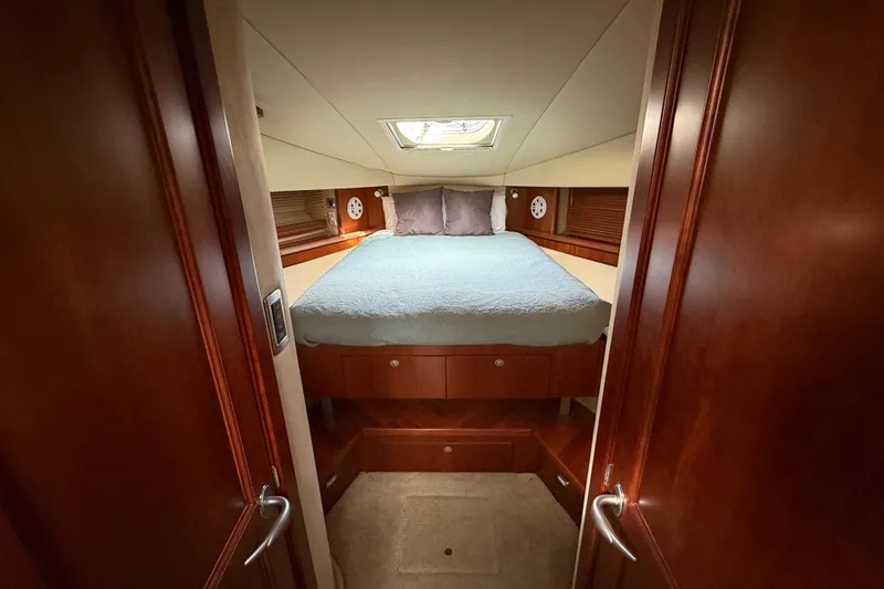Slide: The Image of Luxurious cabin interior of 2006 Sea Ray 48 Sundancer yacht with cozy bed. - 66