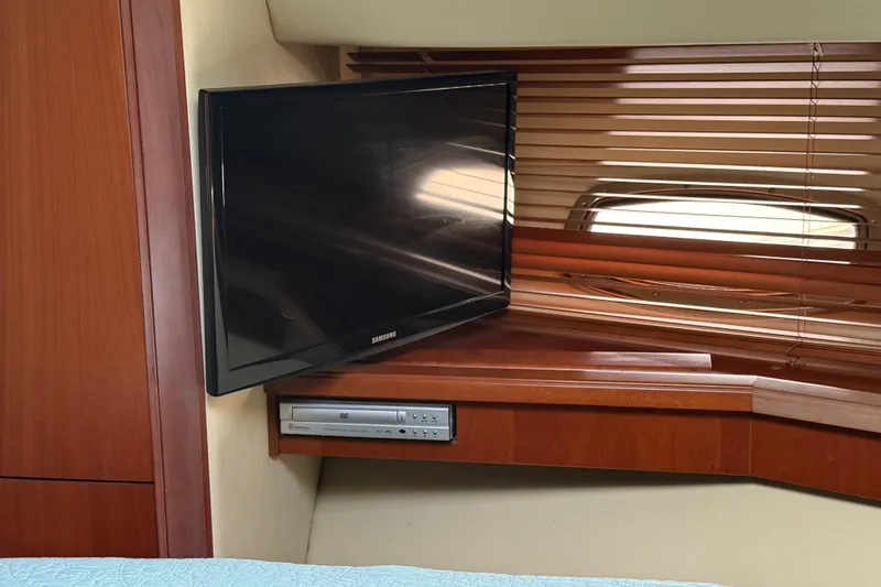 Slide: The Image of Interior of 2006 Sea Ray 48 Sundancer with TV and DVD player setup. - 71