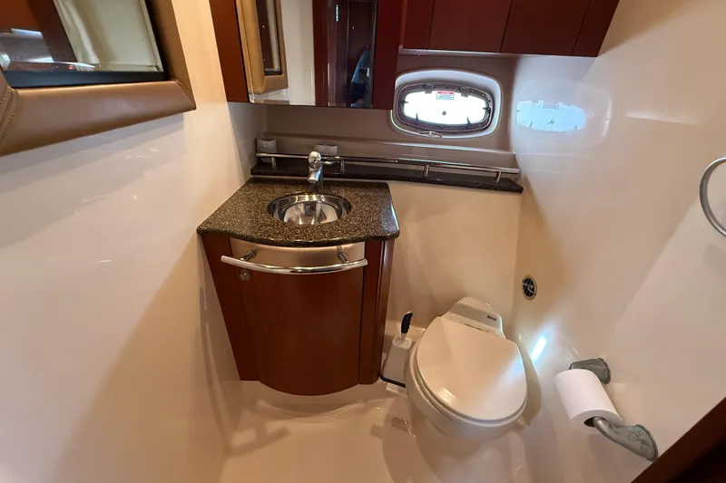 Slide: The Image of Luxurious bathroom in 2006 Sea Ray 48 Sundancer yacht with sink and toilet. - 76