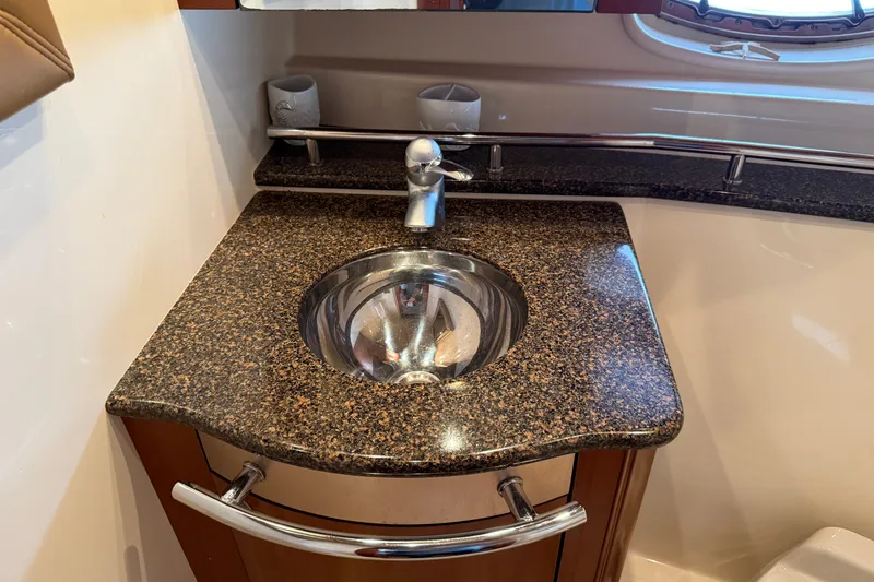Slide: The Image of Luxury bathroom sink in 2006 Sea Ray 48 Sundancer yacht with granite countertop. - 77