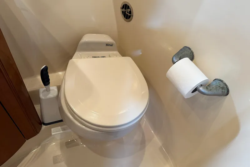 Slide: The Image of Toilet and paper holder in 2006 Sea Ray 48 Sundancer yacht bathroom. - 78