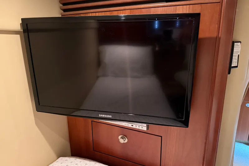 Slide: The Image of Flat-screen TV in 2006 Sea Ray 48 Sundancer yacht interior, mounted on wooden panel. - 91