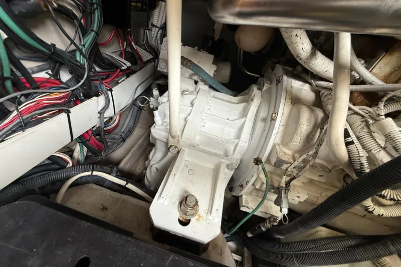 Slide: The Image of Engine compartment of a 2006 Sea Ray 48 Sundancer with visible wiring and components. - 96