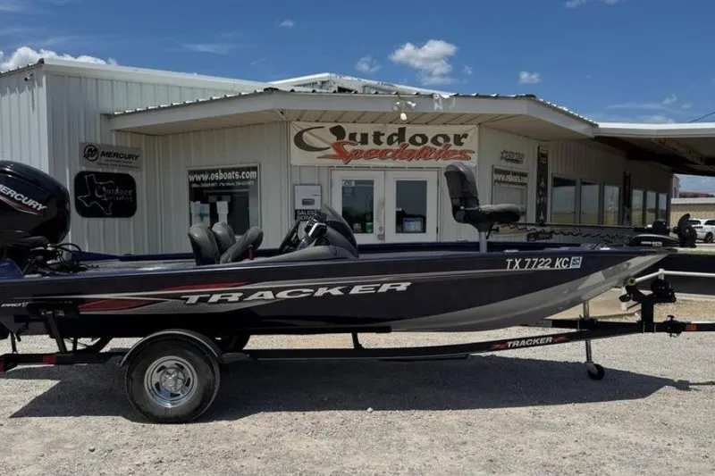 The Image of 2021 Tracker Pro Team 175 TF boat parked outside Outdoor Specialties store. - 1