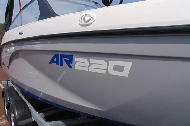 Slide: The Image of 2026 Yamaha Boats AR220 on trailer, showcasing sleek design and branding. - 11