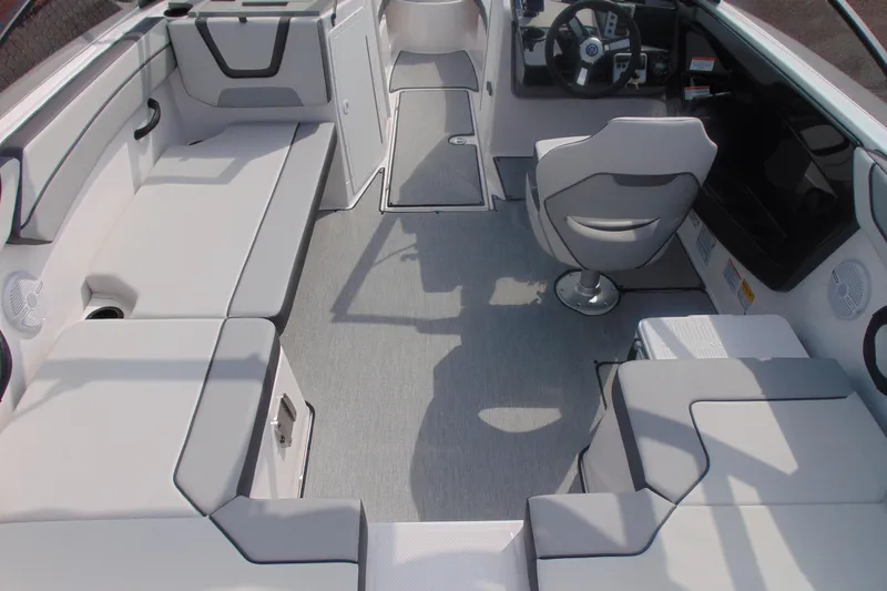 Slide: The Image of 2026 Yamaha Boats AR220 interior with modern seating and steering console. - 14