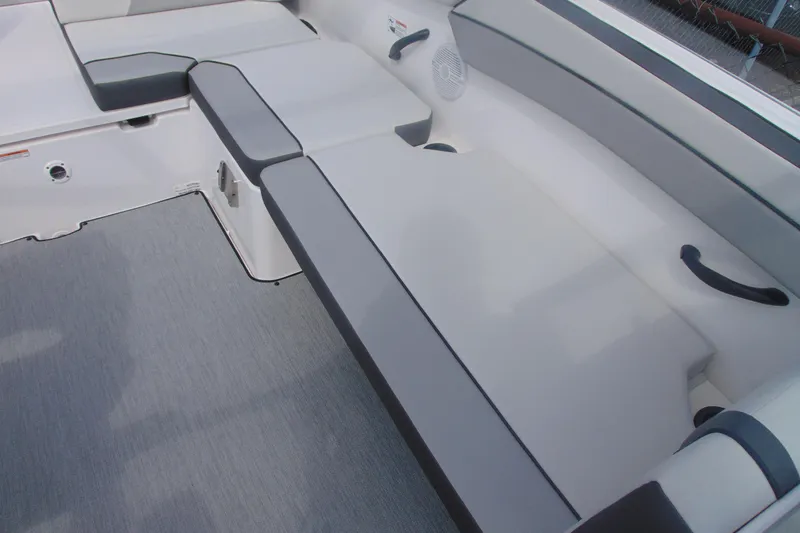 Slide: The Image of 2026 Yamaha Boats AR220 interior seating with gray upholstery and modern design. - 20