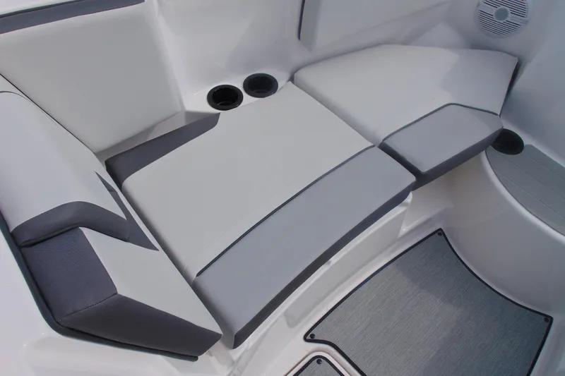 Slide: The Image of Interior seating of 2026 Yamaha Boats AR220 with cup holders and speaker. - 23