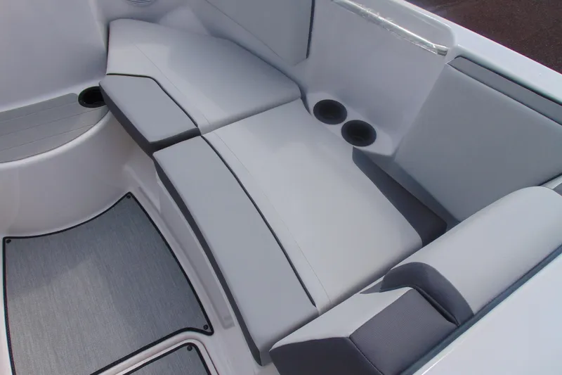 Slide: The Image of Interior seating of 2026 Yamaha Boats AR220 with cup holders and cushioned seats. - 24