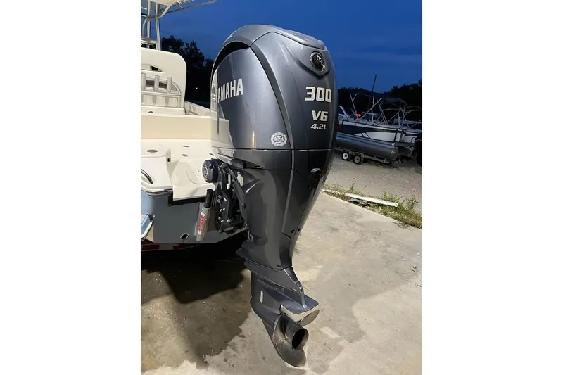 Slide: The Image of 2023 Pathfinder 2600 HPS with Yamaha 300 V6 outboard motor at dusk. - 13