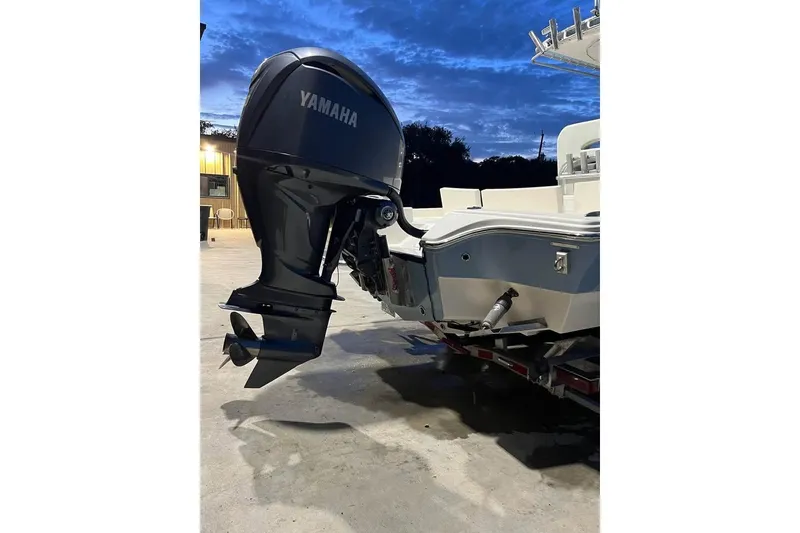 Slide: The Image of 2023 Pathfinder 2600 HPS boat with Yamaha outboard motor at dusk. - 14