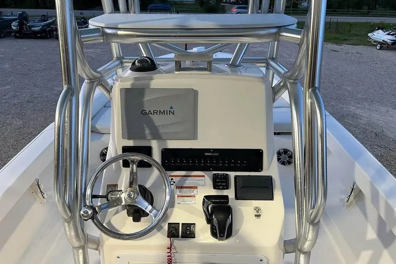 Slide: The Image of 2023 Pathfinder 2600 HPS boat console with Garmin navigation system and steering wheel. - 15