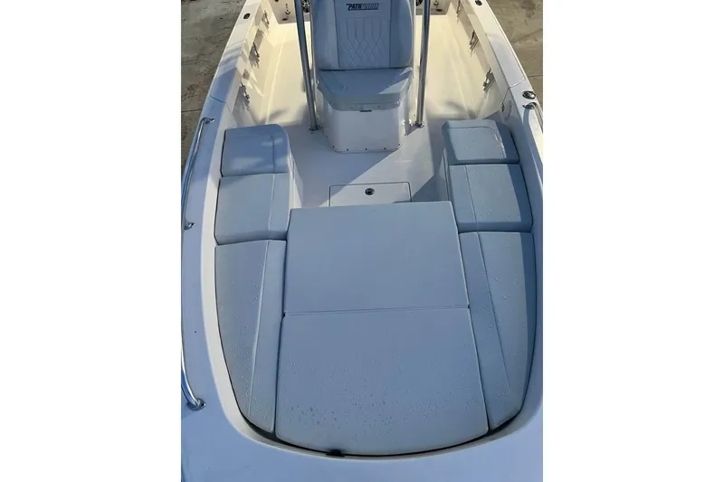 Slide: The Image of 2023 Pathfinder 2600 HPS boat interior with cushioned seating and storage compartments. - 18