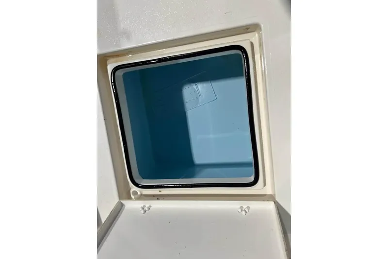 Slide: The Image of 2023 Pathfinder 2600 HPS storage compartment with blue interior and black seal. - 19