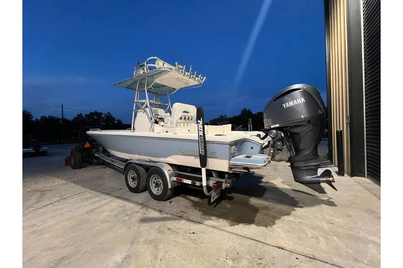 Slide: The Image of 2023 Pathfinder 2600 HPS boat with Yamaha engine on a trailer at dusk. - 4
