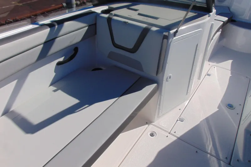 Slide: The Image of 2026 Yamaha Boats AR220 interior seating and storage area, featuring sleek design and modern amenities. - 10