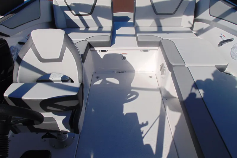 Slide: The Image of 2026 Yamaha Boats AR220 interior with modern seating and sleek design. - 11