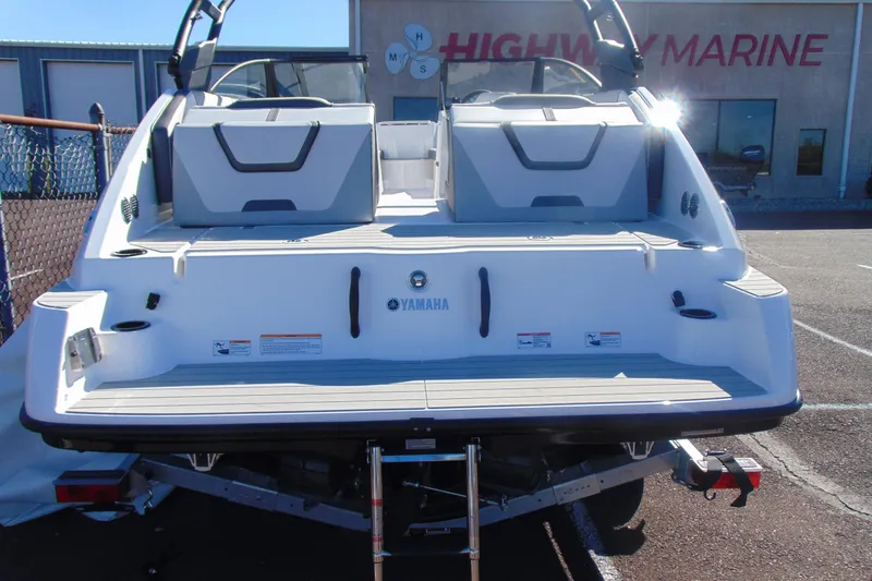 Slide: The Image of 2026 Yamaha Boats AR220 at Highway Marine dealership, rear view. - 5