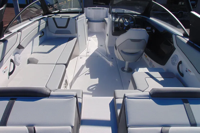 Slide: The Image of 2026 Yamaha Boats AR220 interior with modern seating and steering console. - 6
