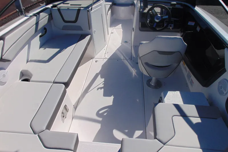 Slide: The Image of 2026 Yamaha Boats AR220 interior with seating and steering console. - 8