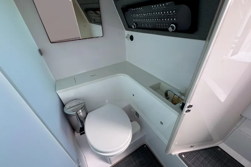 Slide: The Image of 2022 Axopar 37 Sun-Top boat bathroom with modern fixtures and compact design. - 15