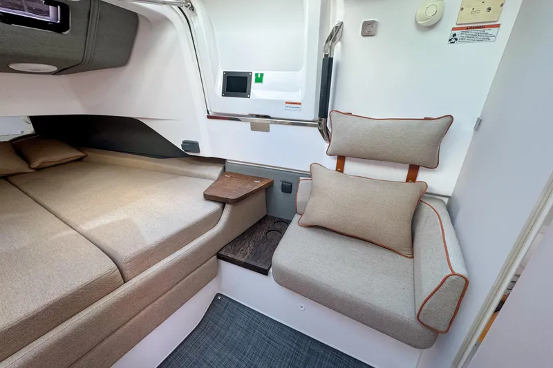 Slide: The Image of Luxurious interior of 2022 Axopar 37 Sun-Top with cozy seating and bed. - 18