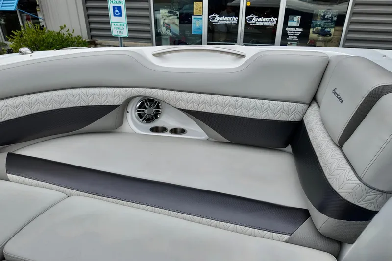 Slide: The Image of 2023 Hurricane Sun Deck 2690 boat interior with stylish seating and speaker system. - 11