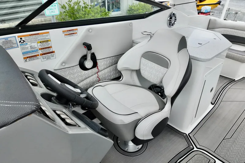 Slide: The Image of 2023 Hurricane Sun Deck 2690 boat interior with modern helm and comfortable seating. - 17