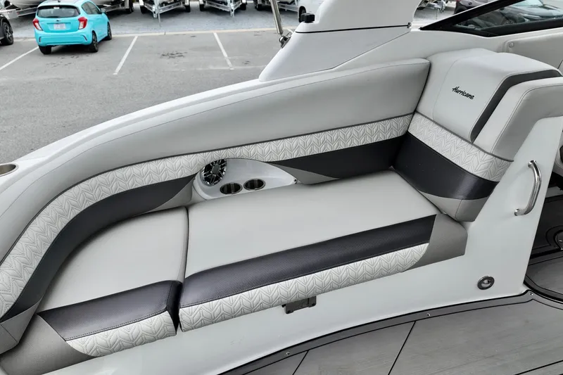 Slide: The Image of 2023 Hurricane Sun Deck 2690 boat interior with stylish seating and cup holders. - 18