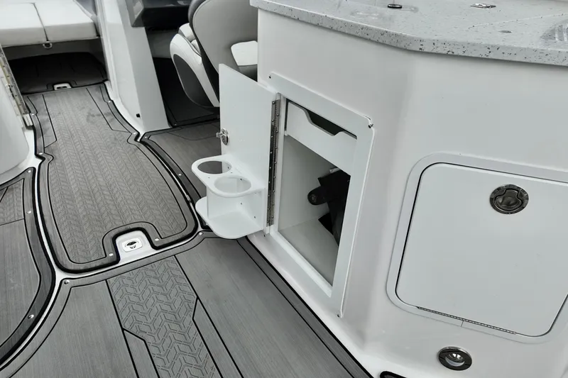 Slide: The Image of 2023 Hurricane Sun Deck 2690 interior with open storage and cup holders. - 19