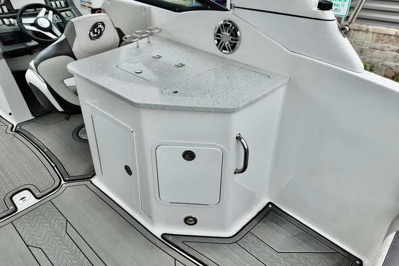 Slide: The Image of 2023 Hurricane Sun Deck 2690 boat interior with sleek countertop and seating. - 21