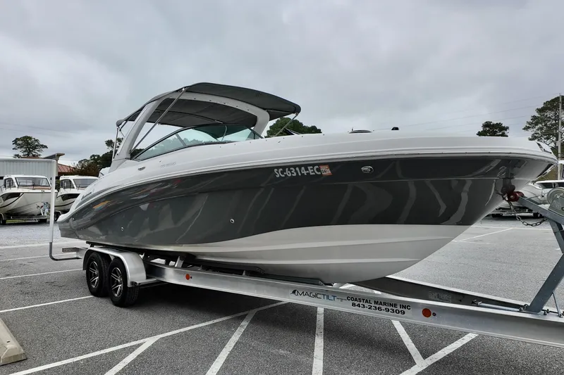 Slide: The Image of 2023 Hurricane Sun Deck 2690 boat on trailer in parking lot. - 3