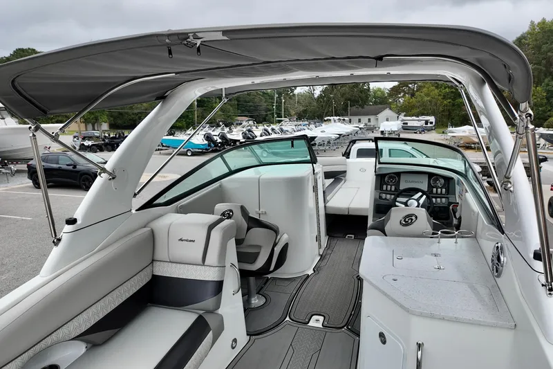 Slide: The Image of 2023 Hurricane Sun Deck 2690 boat interior with seating and control panel. - 6