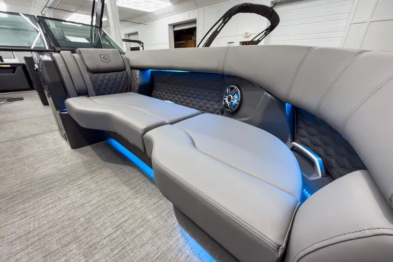 Slide: The Image of Luxurious interior of 2026 Godfrey Sanpan 27' Tritoon with elegant seating and ambient lighting. - 14